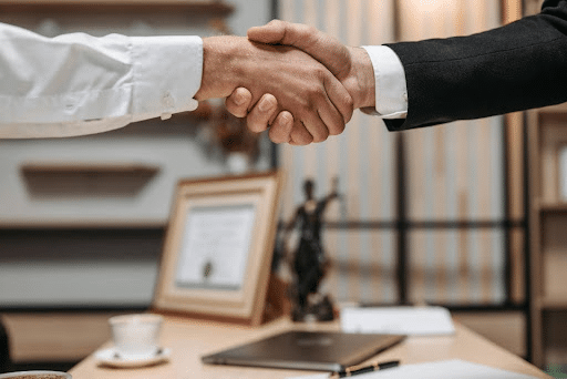 Business handshake in office